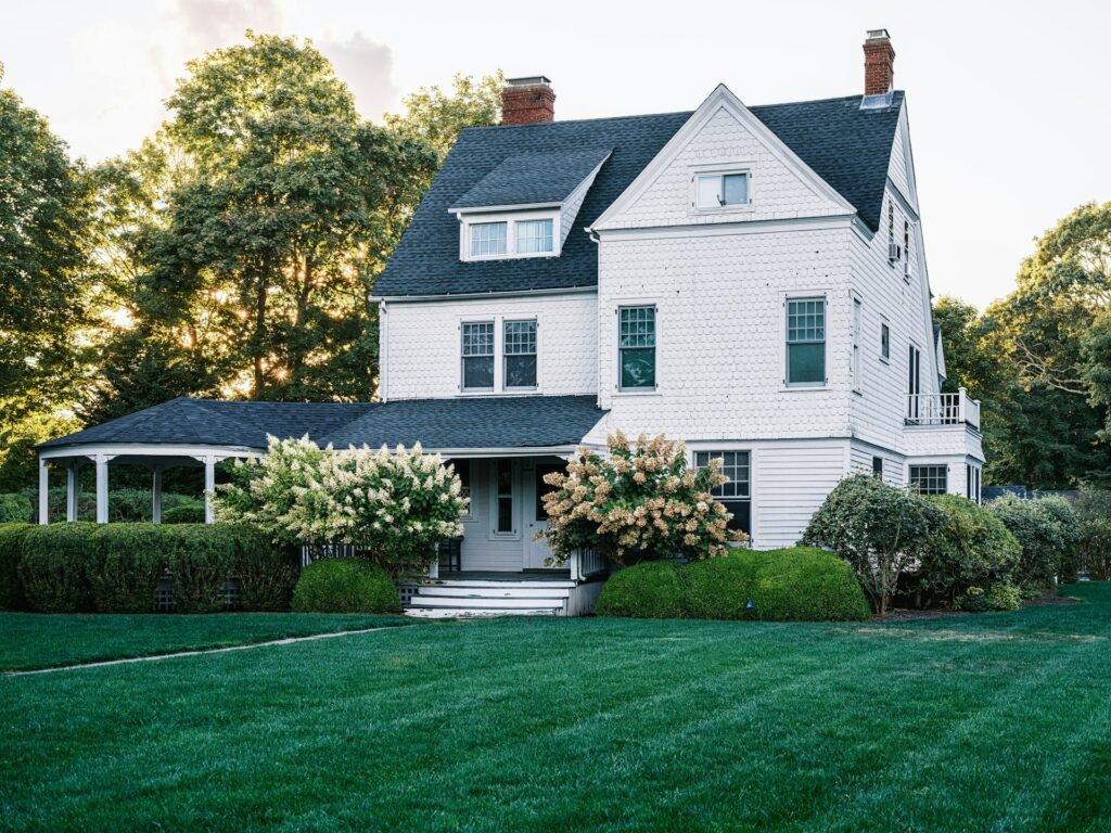 Large house exterior with green lawn